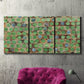 Three-panel canvas wall art featuring geometric fractal abstract slot pattern, displayed in a living room above a suede accent chair.