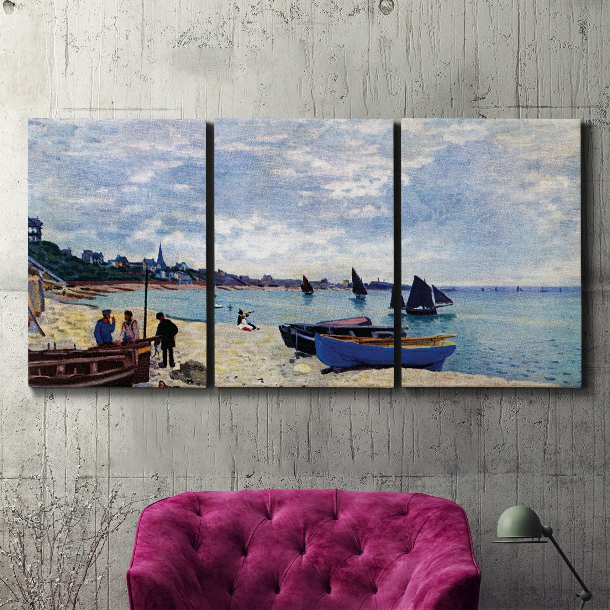Three-panel canvas wall art featuring busy beach scene with shoreline, displayed in a living room above a suede accent chair.