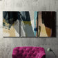 Three-panel canvas wall art featuring layered neutral abstract textures, displayed in a living room above a suede accent chair.