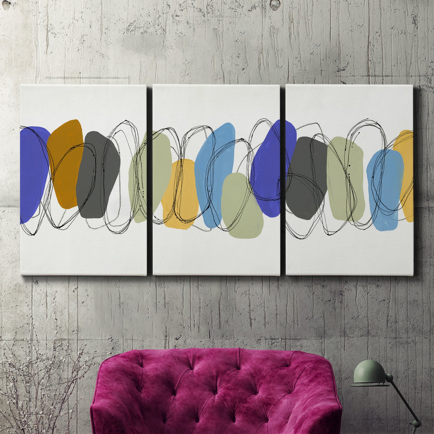 Three-panel canvas wall art featuring minimalist geometric abstract spacing, displayed in a living room above a suede accent chair.