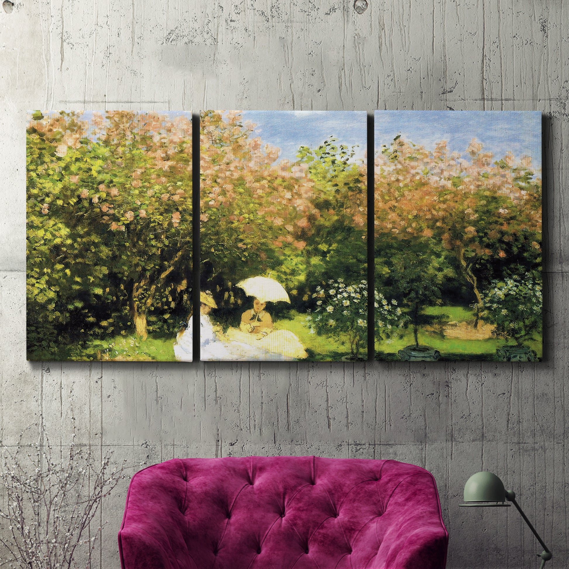 Three-panel canvas wall art featuring lush garden landscape with trees, displayed in a living room above a suede accent chair.