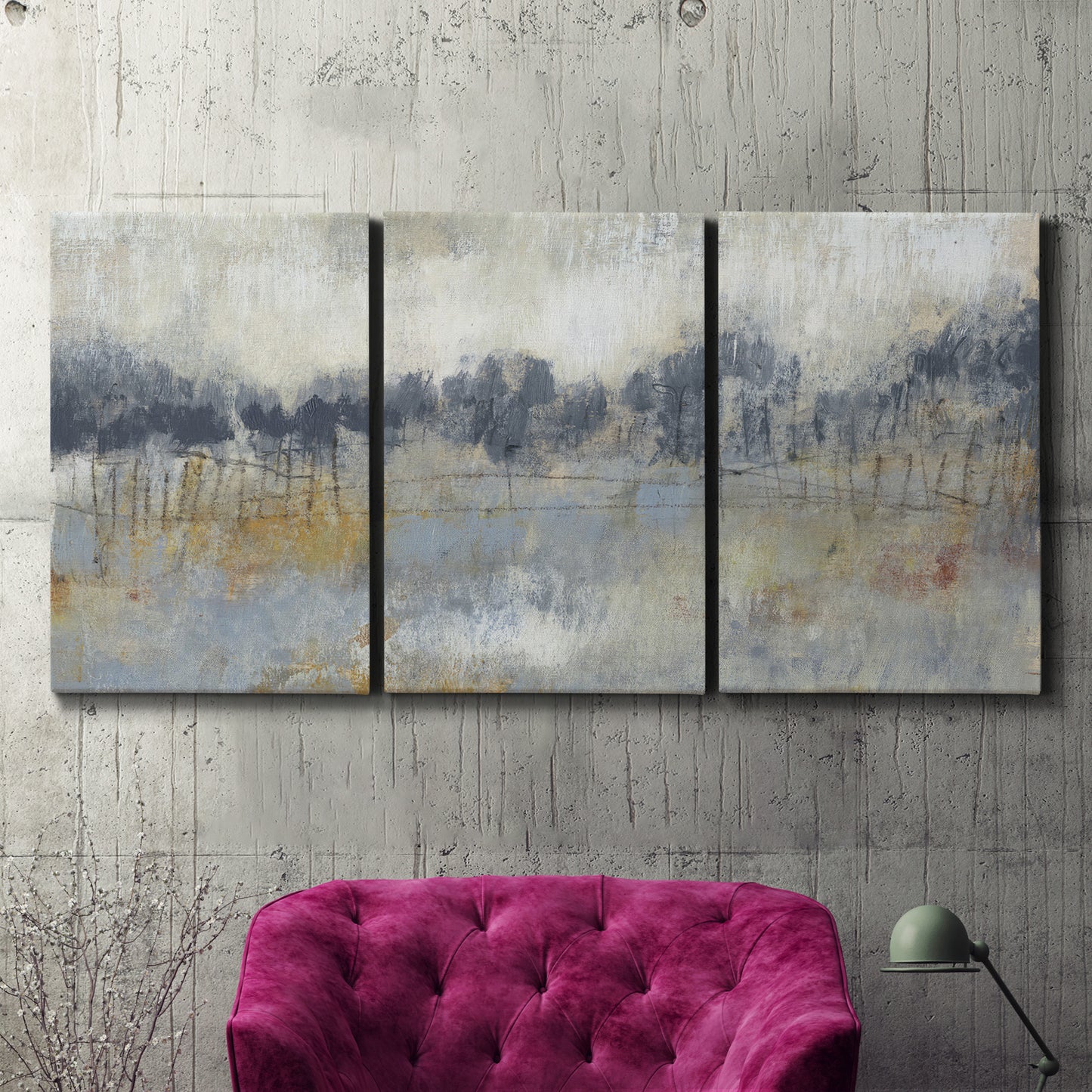Three-panel canvas wall art featuring soft grey abstract horizon, displayed in a living room above a suede accent chair.