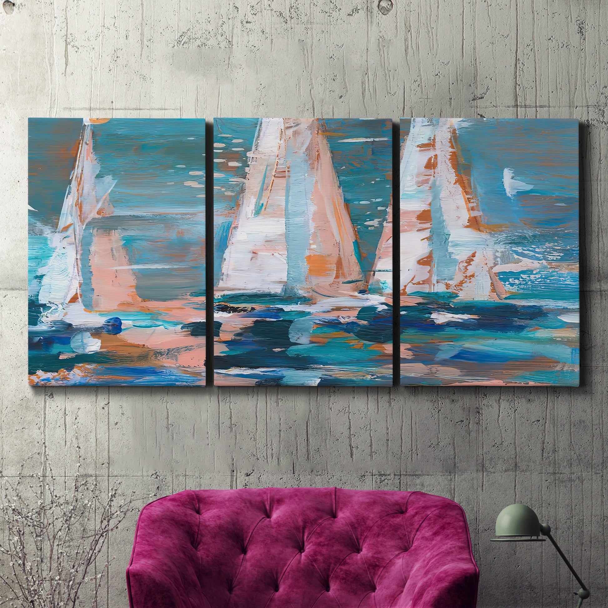 Three-panel canvas wall art featuring graphic pop style sailboats, displayed in a living room above a suede accent chair.