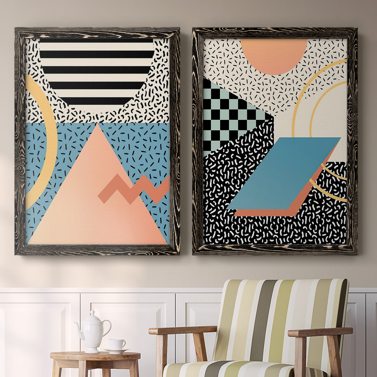 Set of two black barnwood framed canvas prints depicting two retro graphic abstracts featuring bold geometric Memphis-style patterns above a sideboard in a cozy sitting room.