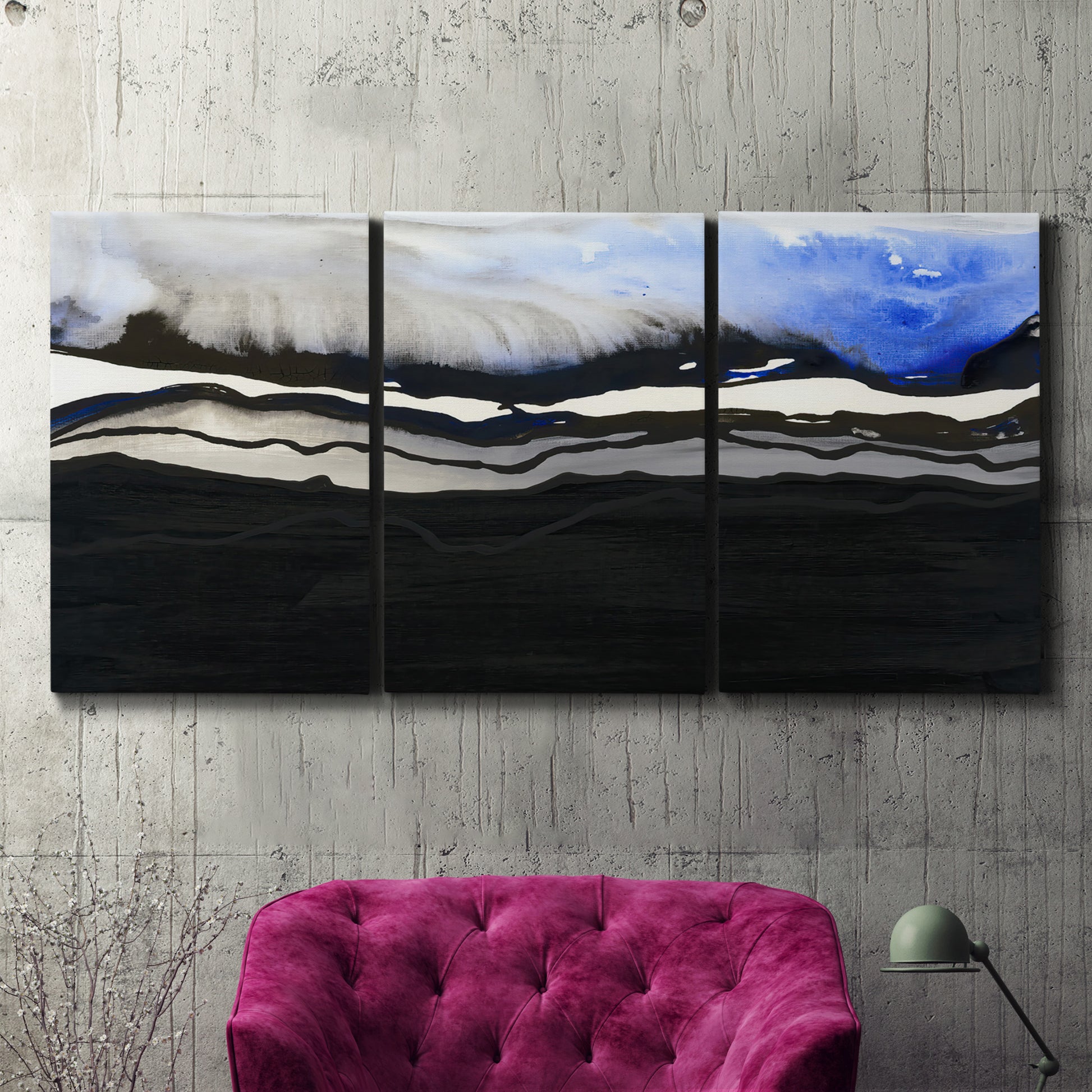 Three-panel canvas wall art featuring abstract passage of time composition, displayed in a living room above a suede accent chair.