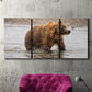 Three-panel canvas wall art featuring wildlife photography animal portrait, displayed in a living room above a suede accent chair.