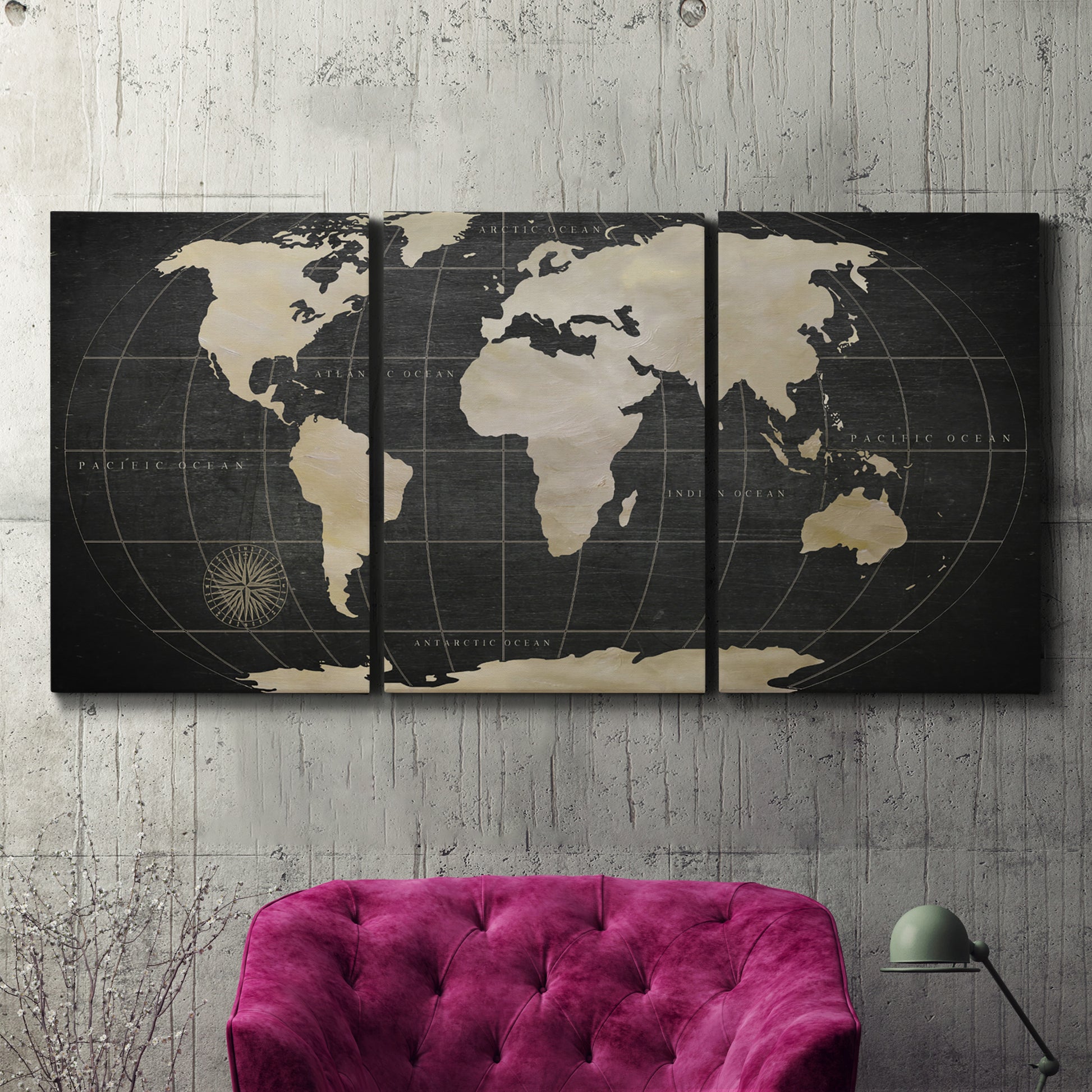 Three-panel canvas wall art featuring antique world map illustration, displayed in a living room above a suede accent chair.