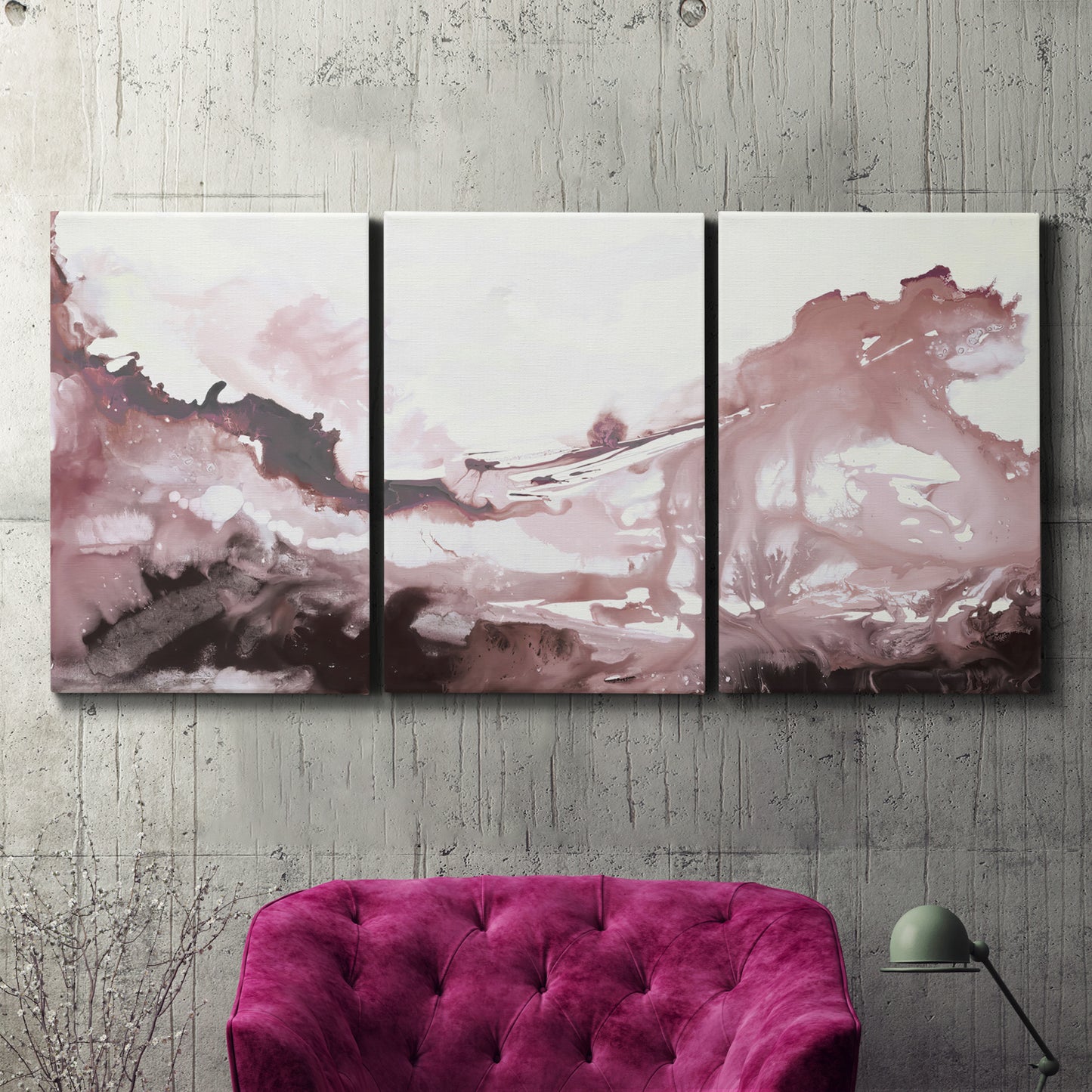 Three-panel canvas wall art featuring soft pink abstract scenic layers, displayed in a living room above a suede accent chair.