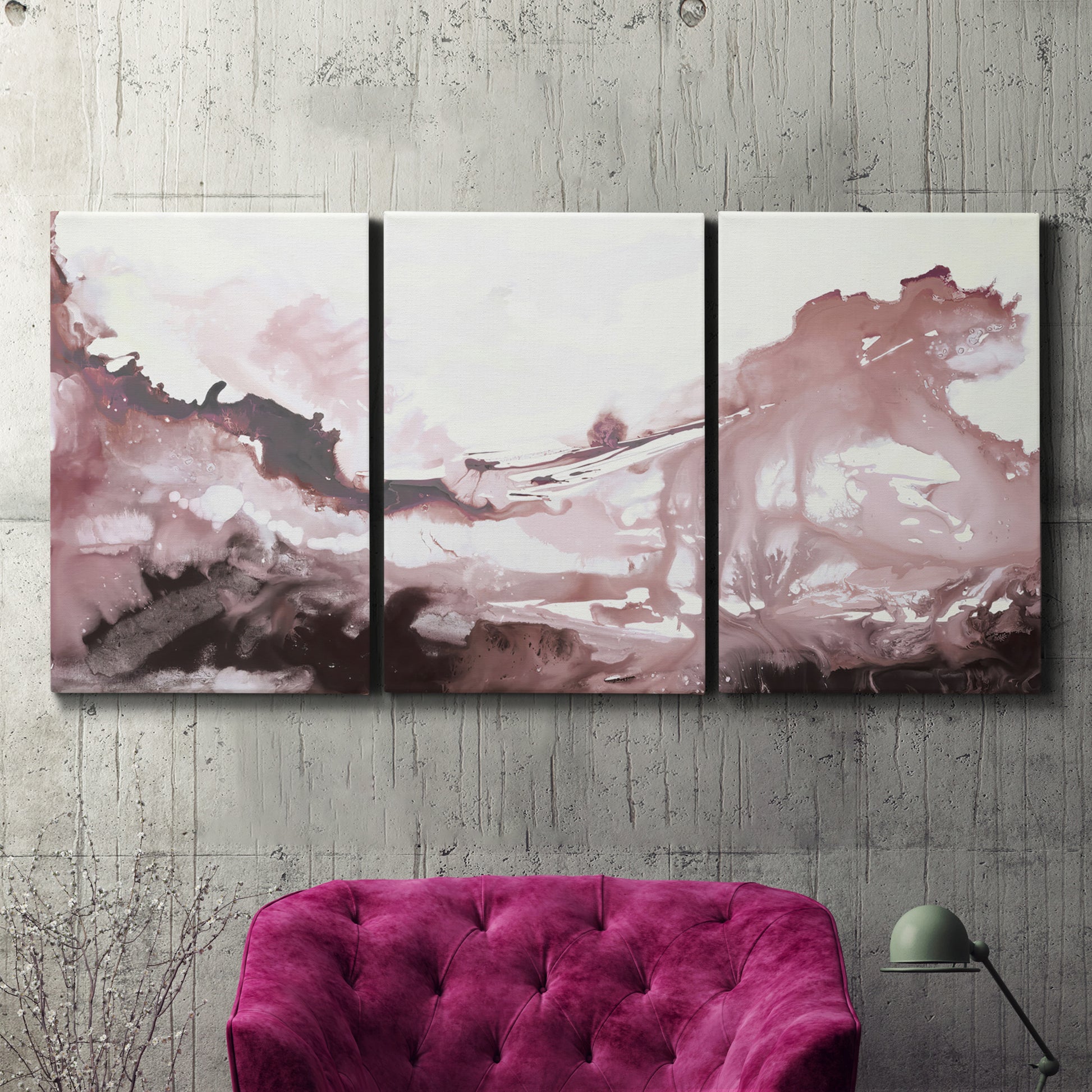 Three-panel canvas wall art featuring soft pink abstract scenic layers, displayed in a living room above a suede accent chair.