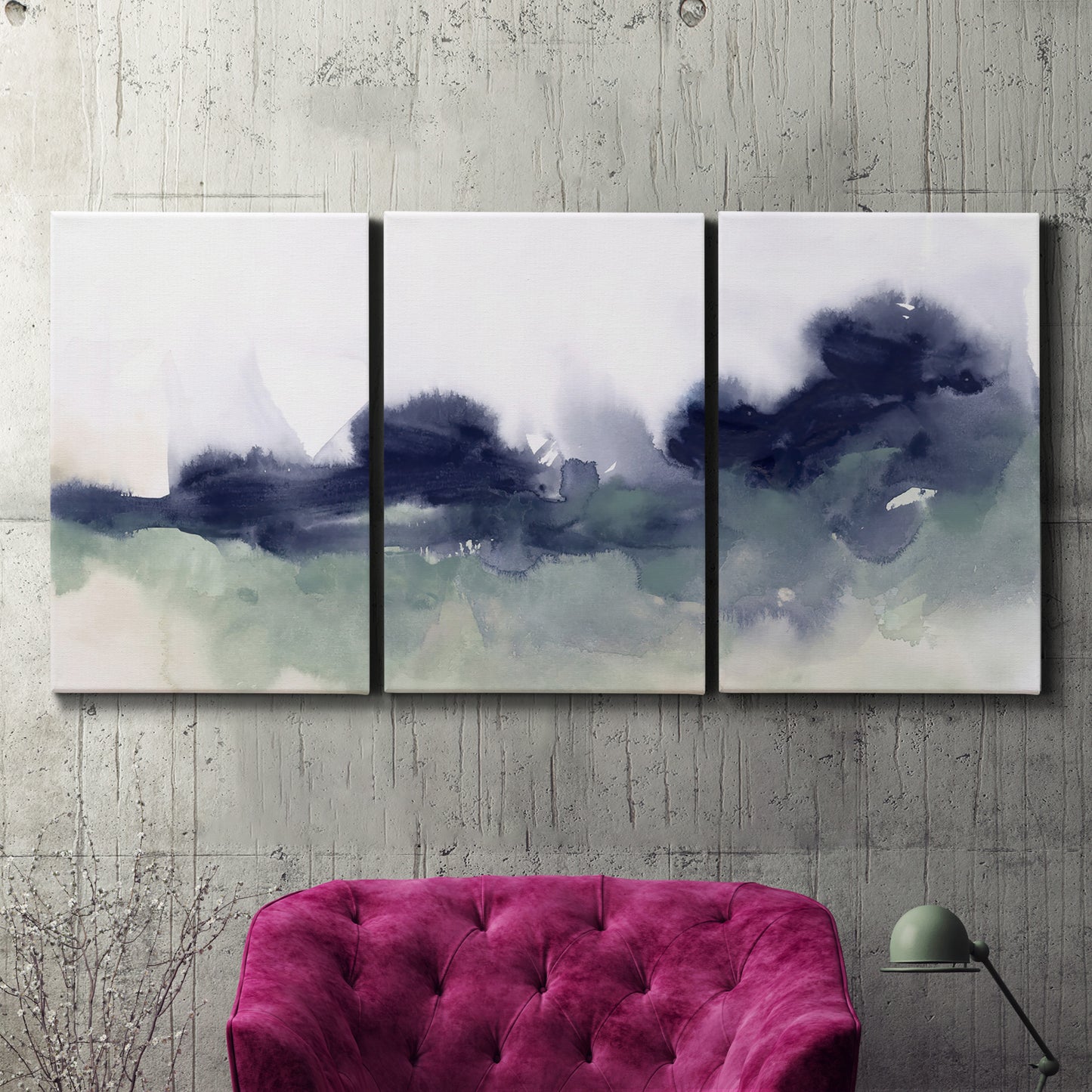 Three-panel canvas wall art featuring misty abstract lake watercolor, displayed in a living room above a suede accent chair.