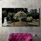 Three-panel canvas wall art featuring woman seated in garden landscape, displayed in a living room above a suede accent chair.