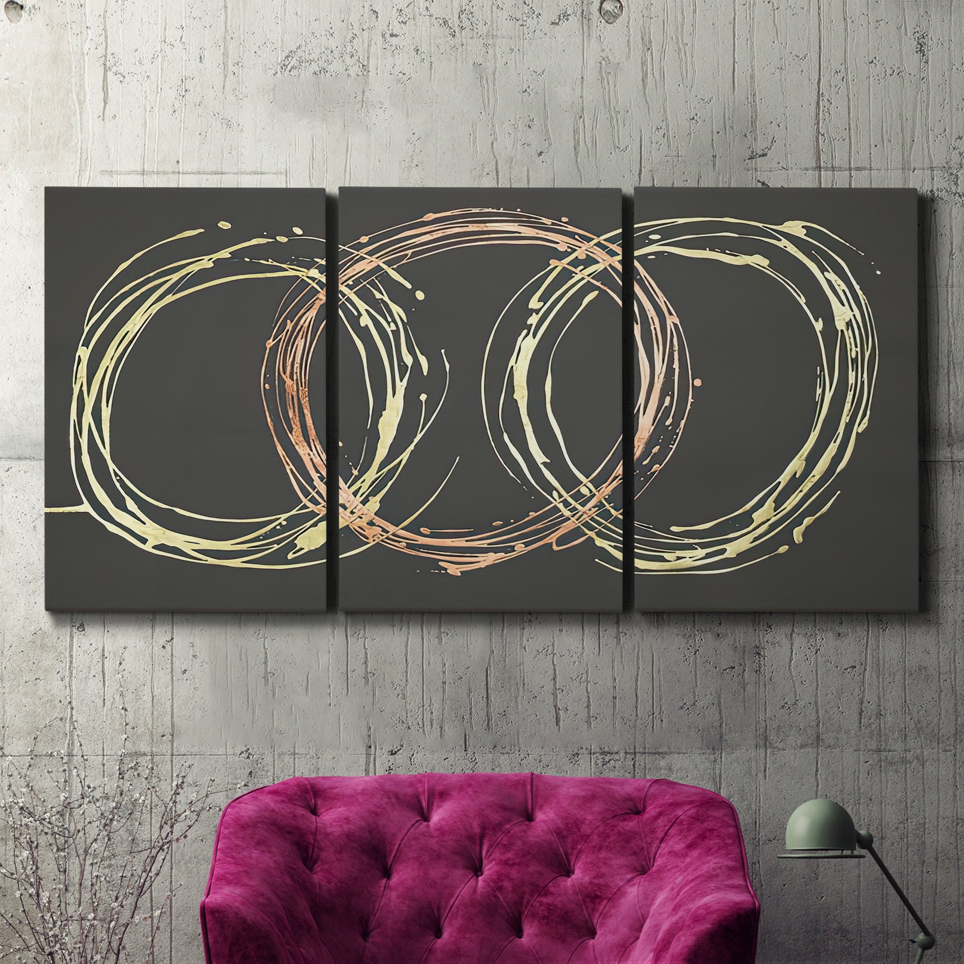 Three-panel canvas wall art featuring geometric abstract wave tangents, displayed in a living room above a suede accent chair.