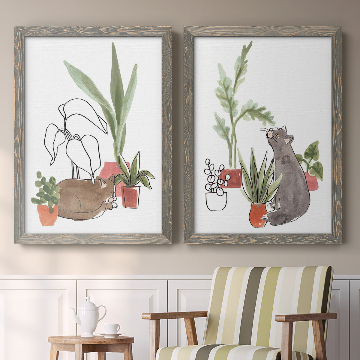 Set of two gray barnwood framed canvas prints depicting two whimsical botanical animal illustrations featuring cats tucked among collections of potted houseplants above a sideboard in a cozy sitting room.