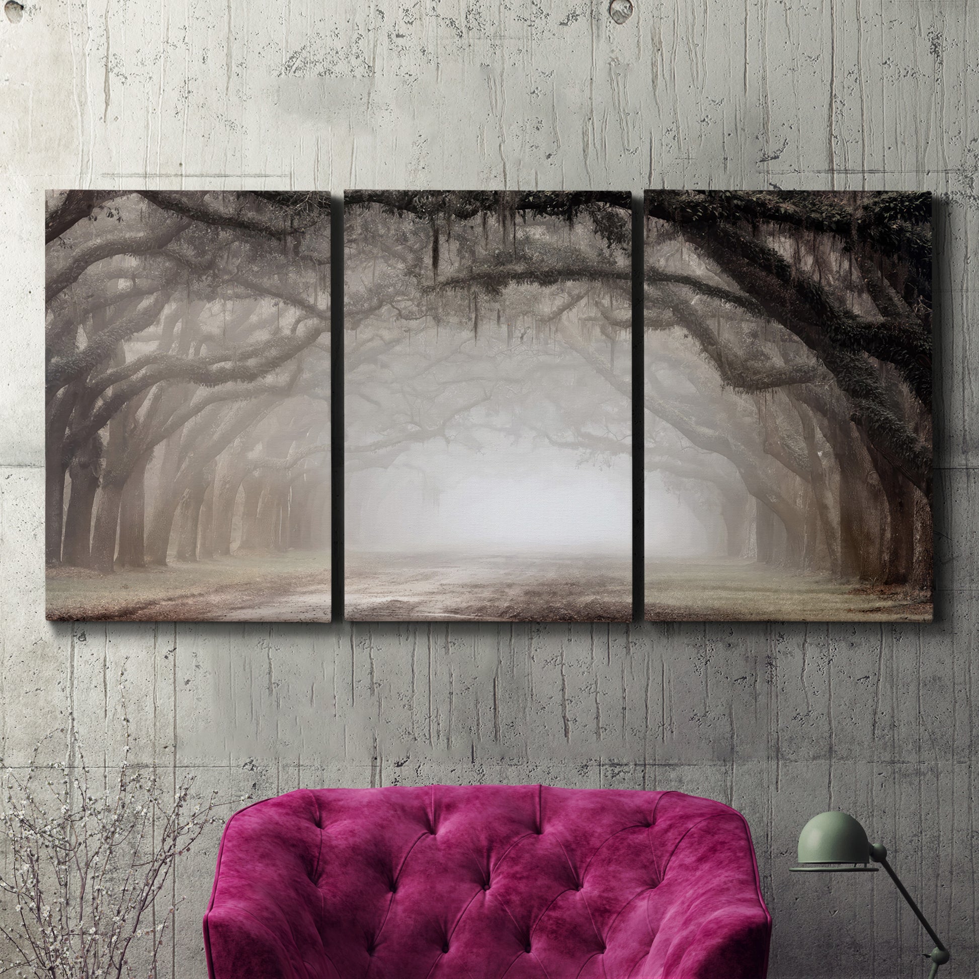 Three-panel canvas wall art featuring tree lined plantation road, displayed in a living room above a suede accent chair.