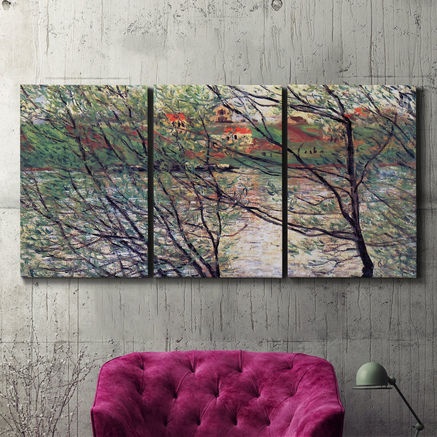 Three-panel canvas wall art featuring riverside park with figures and trees, displayed in a living room above a suede accent chair.