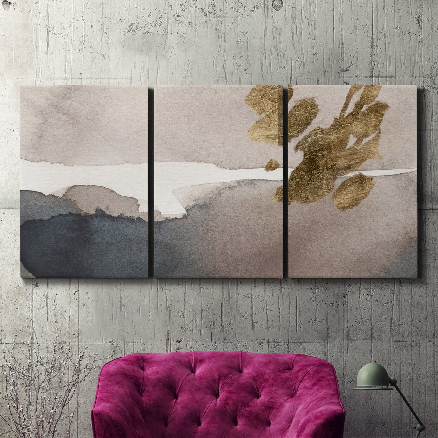 Three-panel canvas wall art featuring abstract watercolor with gold accents, displayed in a living room above a suede accent chair.