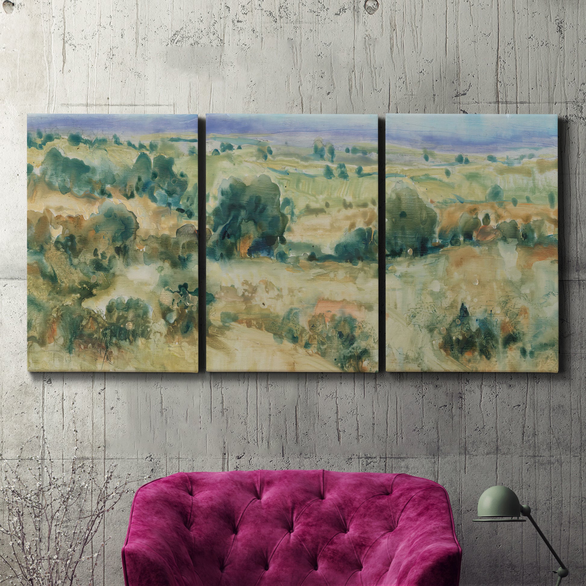 Three-panel canvas wall art featuring lavender sky over quiet landscape, displayed in a living room above a suede accent chair.