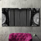 Three-panel canvas wall art featuring vintage car grille detail, displayed in a living room above a suede accent chair.