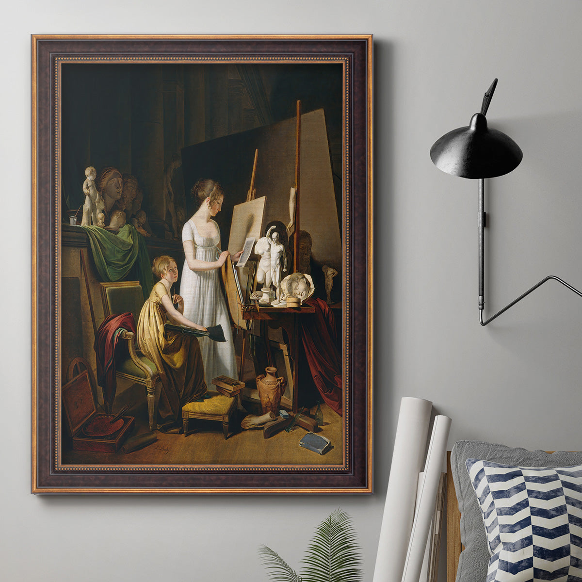 Classical interior painting of an artist at work by Louis-Leopold Boilly in an ornate bronzed mahogany wood frame displayed in a neutral interior setting.