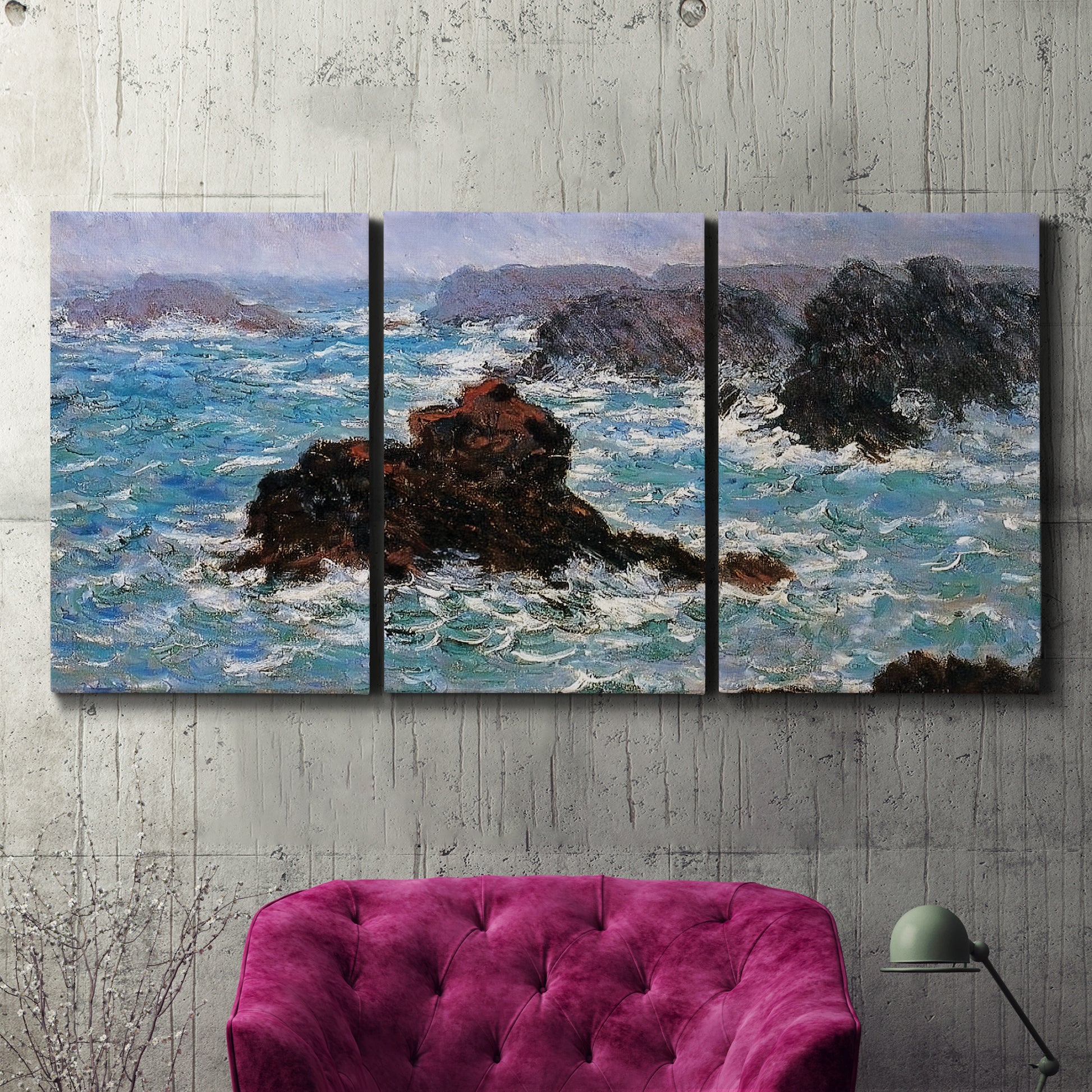 Three-panel canvas wall art featuring storm waves battering rocky coast, displayed in a living room above a suede accent chair.