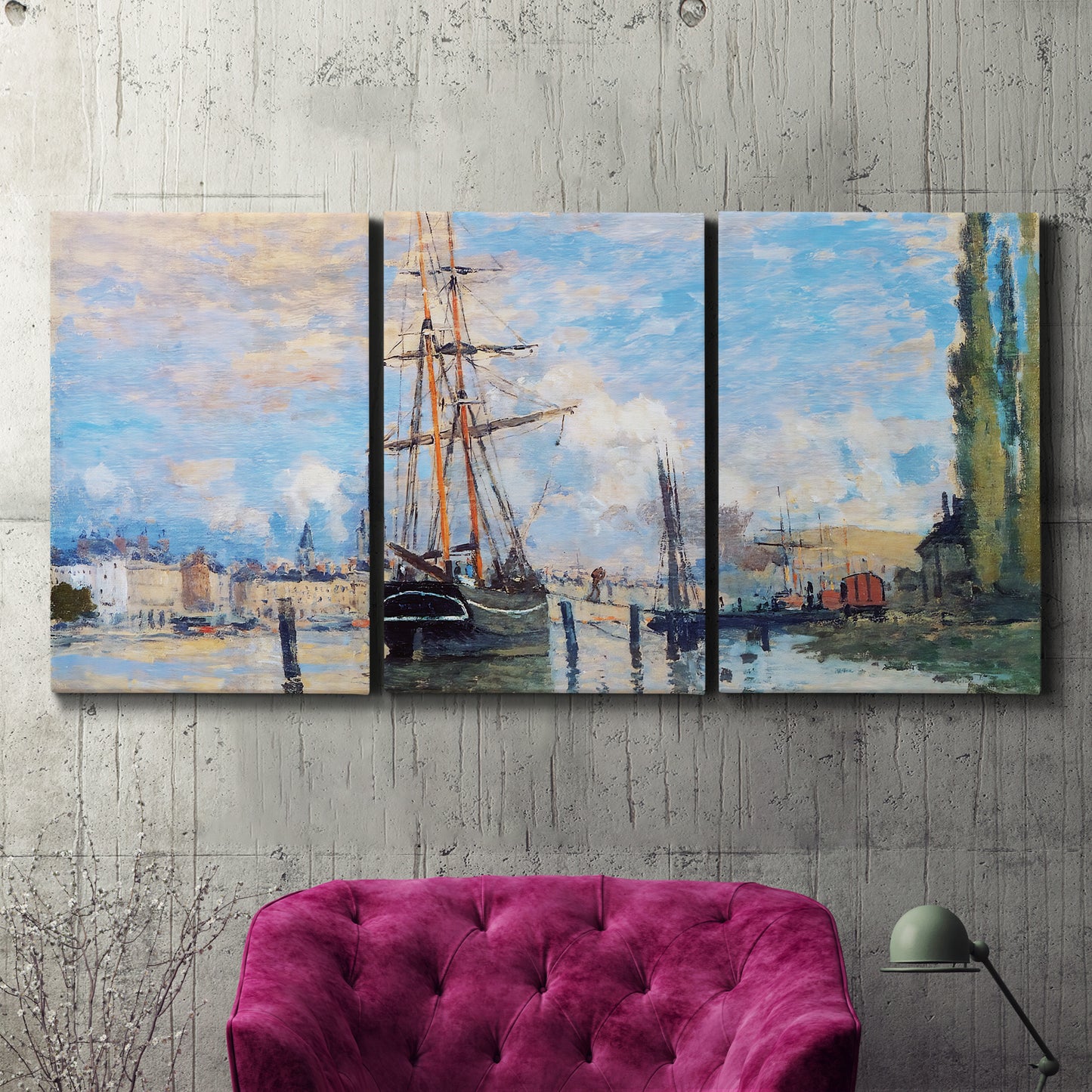 Three-panel canvas wall art featuring busy river port scene, displayed in a living room above a suede accent chair.