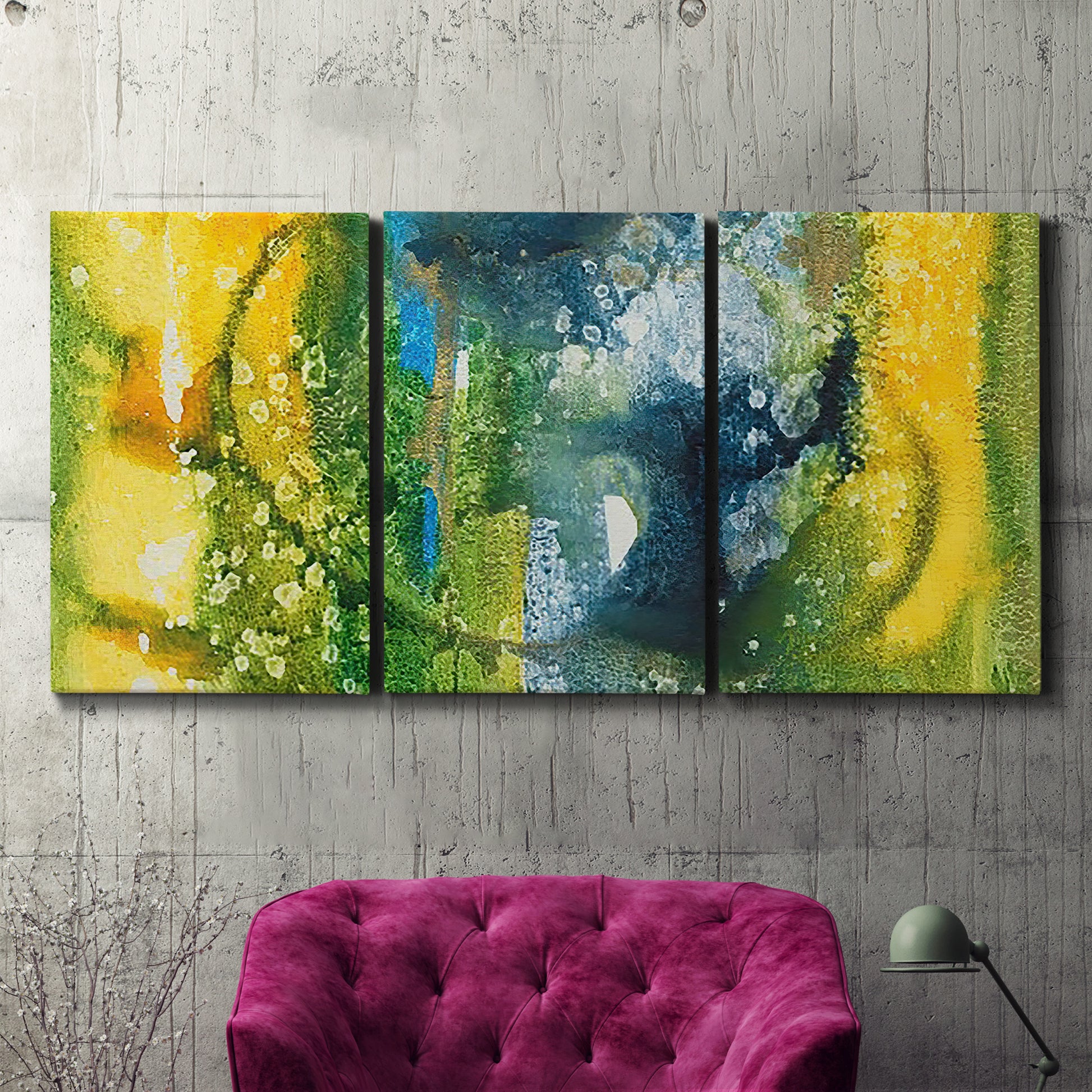 Three-panel canvas wall art featuring energetic abstract aquatic color motion, displayed in a living room above a suede accent chair.