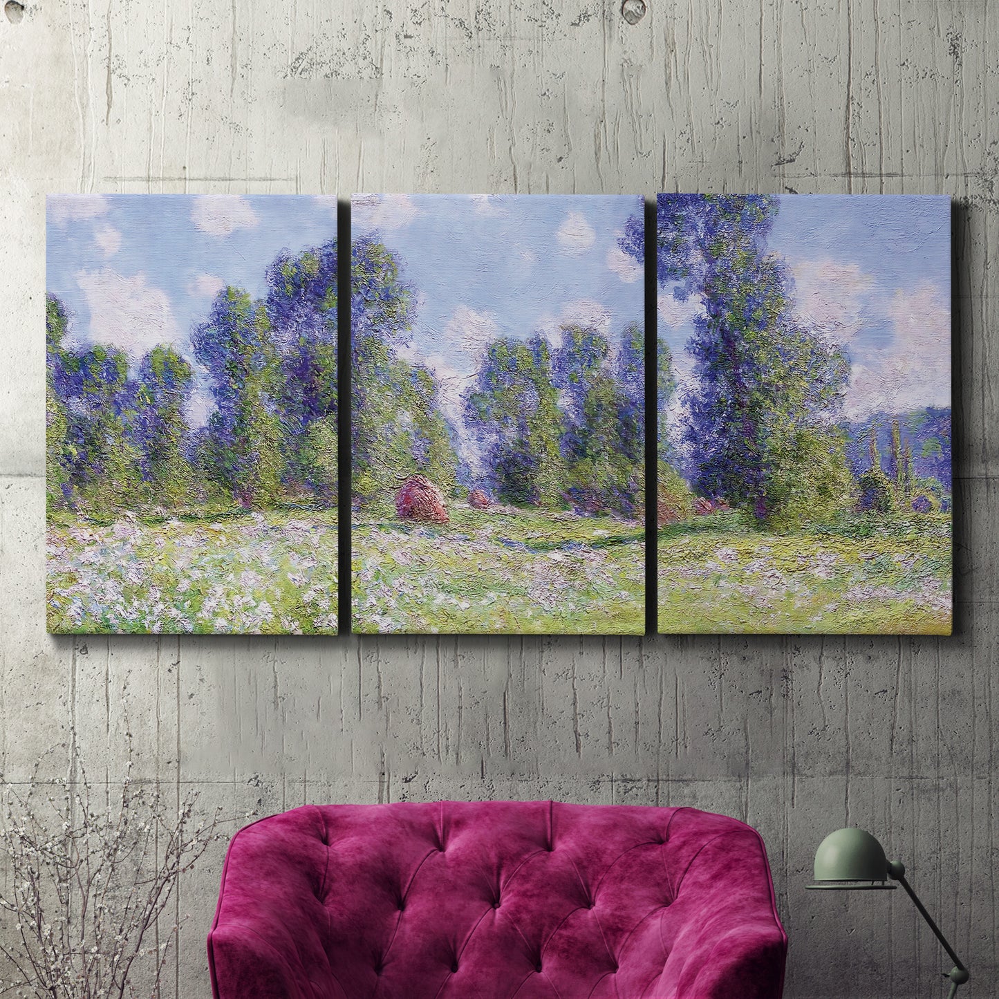 Three-panel canvas wall art featuring poppy field near garden village, displayed in a living room above a suede accent chair.