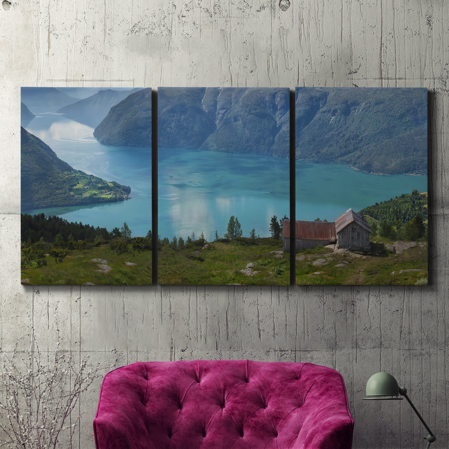 Three-panel canvas wall art featuring symmetrical water reflections with trees, displayed in a living room above a suede accent chair.