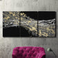 Three-panel canvas wall art featuring dark modern abstract wind patterns, displayed in a living room above a suede accent chair.