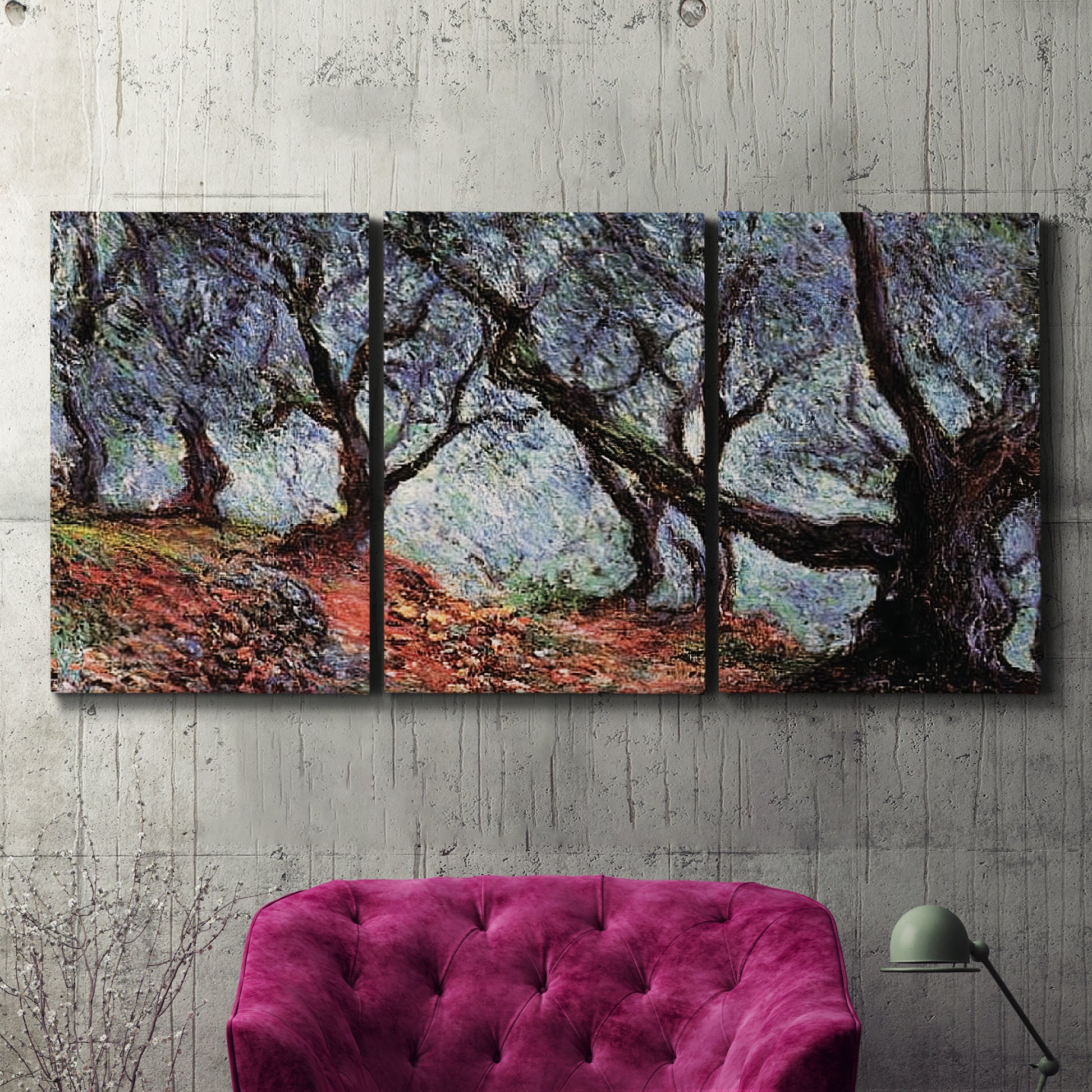 Three-panel canvas wall art featuring pine trees silhouetted at evening, displayed in a living room above a suede accent chair.