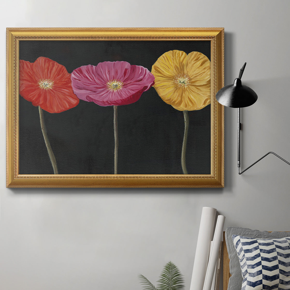 Contemporary poppy flower artwork in an ornate antique gold frame displayed in a neutral interior setting.