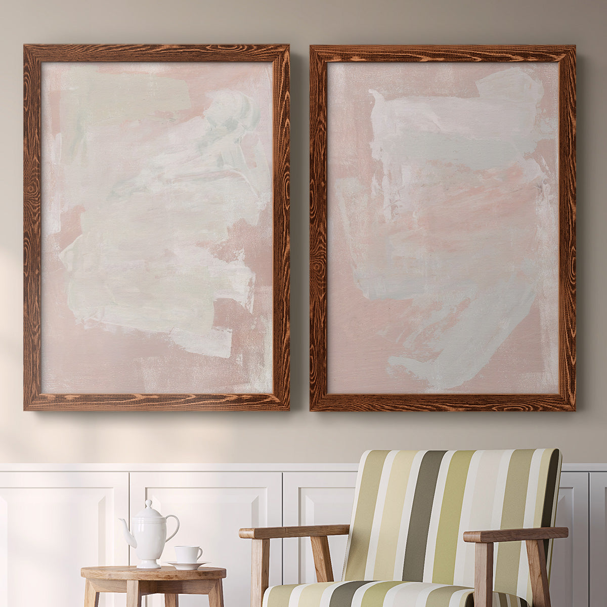 Set of two maple barnwood framed canvas prints depicting two minimalist color-field abstracts featuring soft blush and white painterly fields above a sideboard in a cozy sitting room.