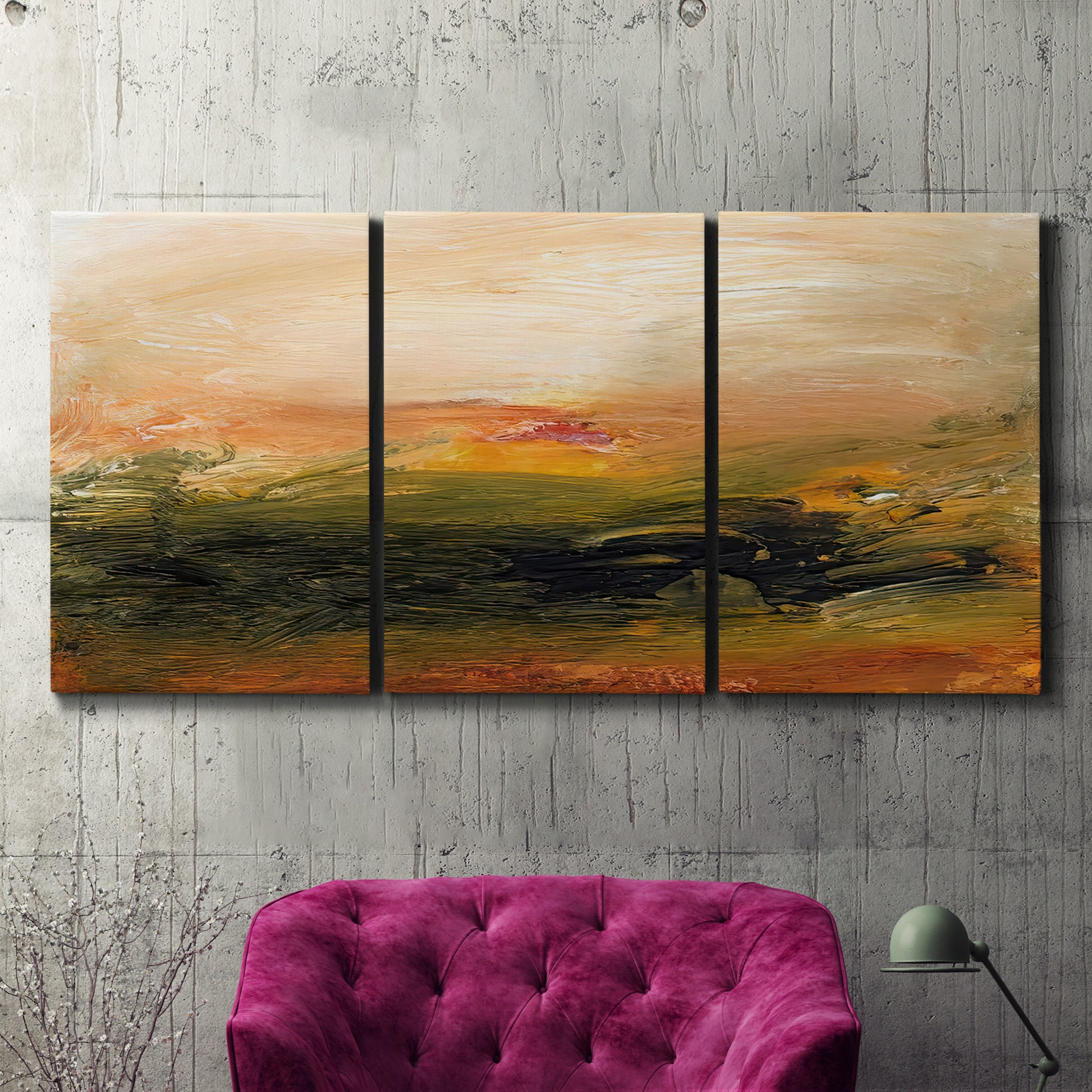 Three-panel canvas wall art featuring soft abstract evening light, displayed in a living room above a suede accent chair.