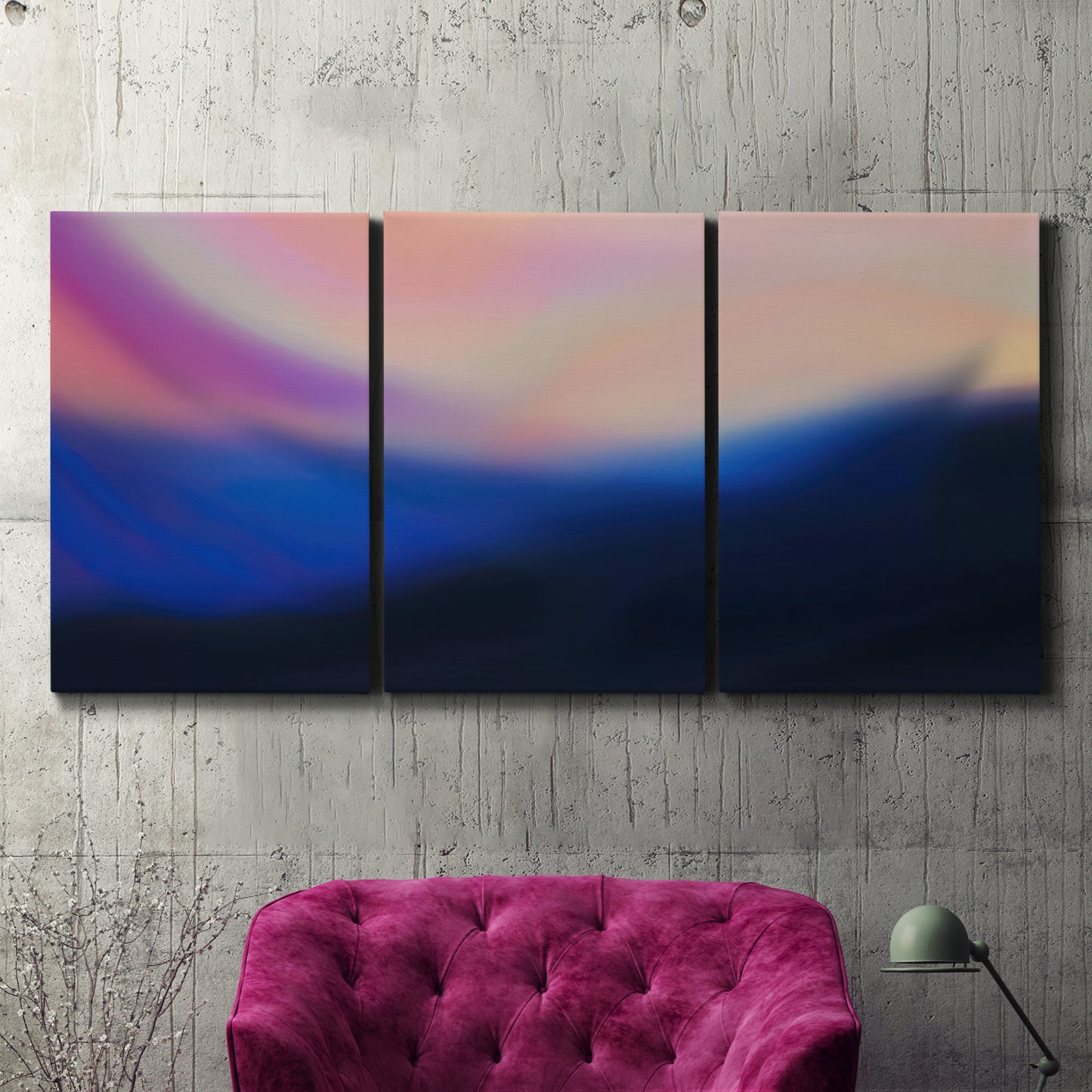 Three-panel canvas wall art featuring smooth abstract sunset color gradient, displayed in a living room above a suede accent chair.