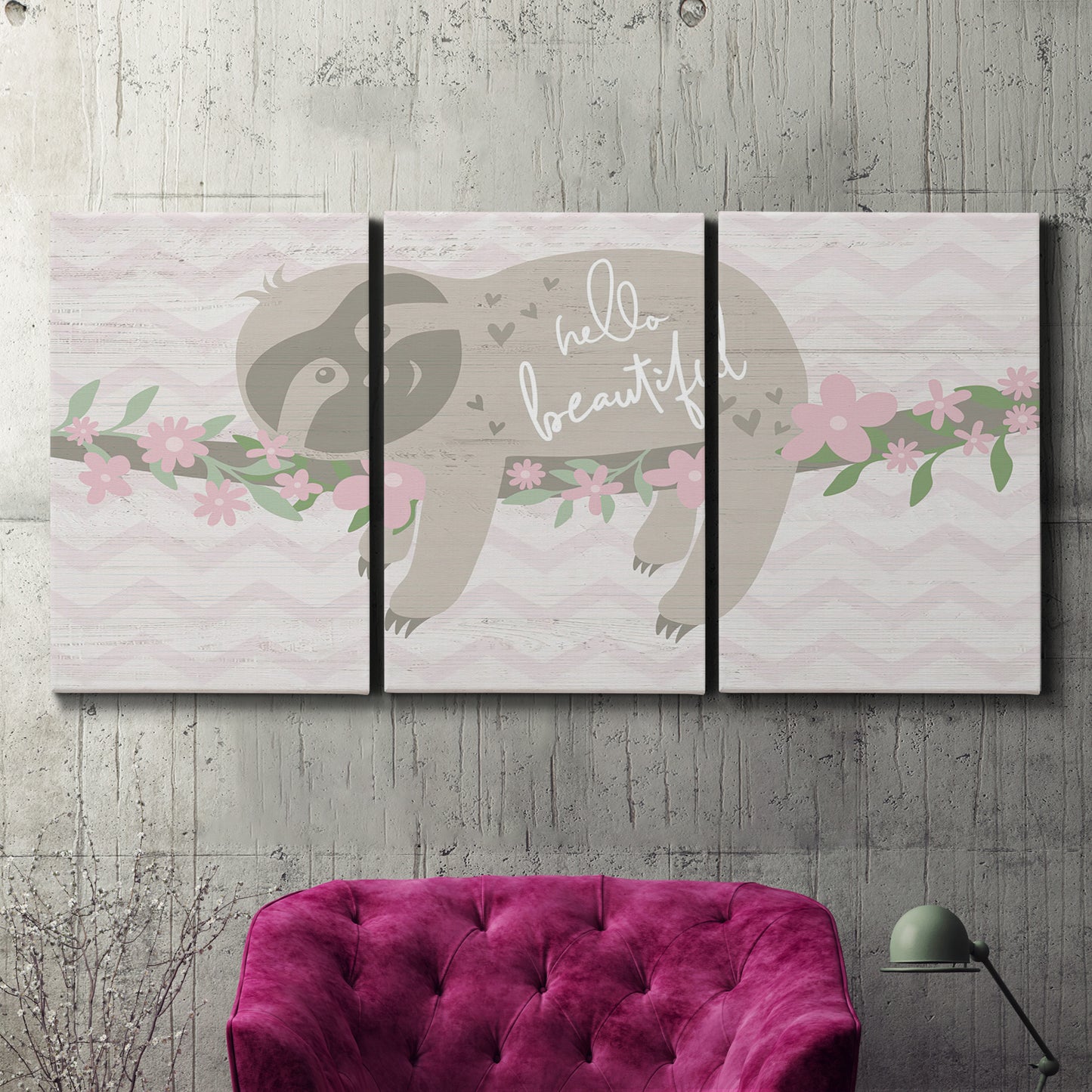 Three-panel canvas wall art featuring sloth with floral decorative elements, displayed in a living room above a suede accent chair.
