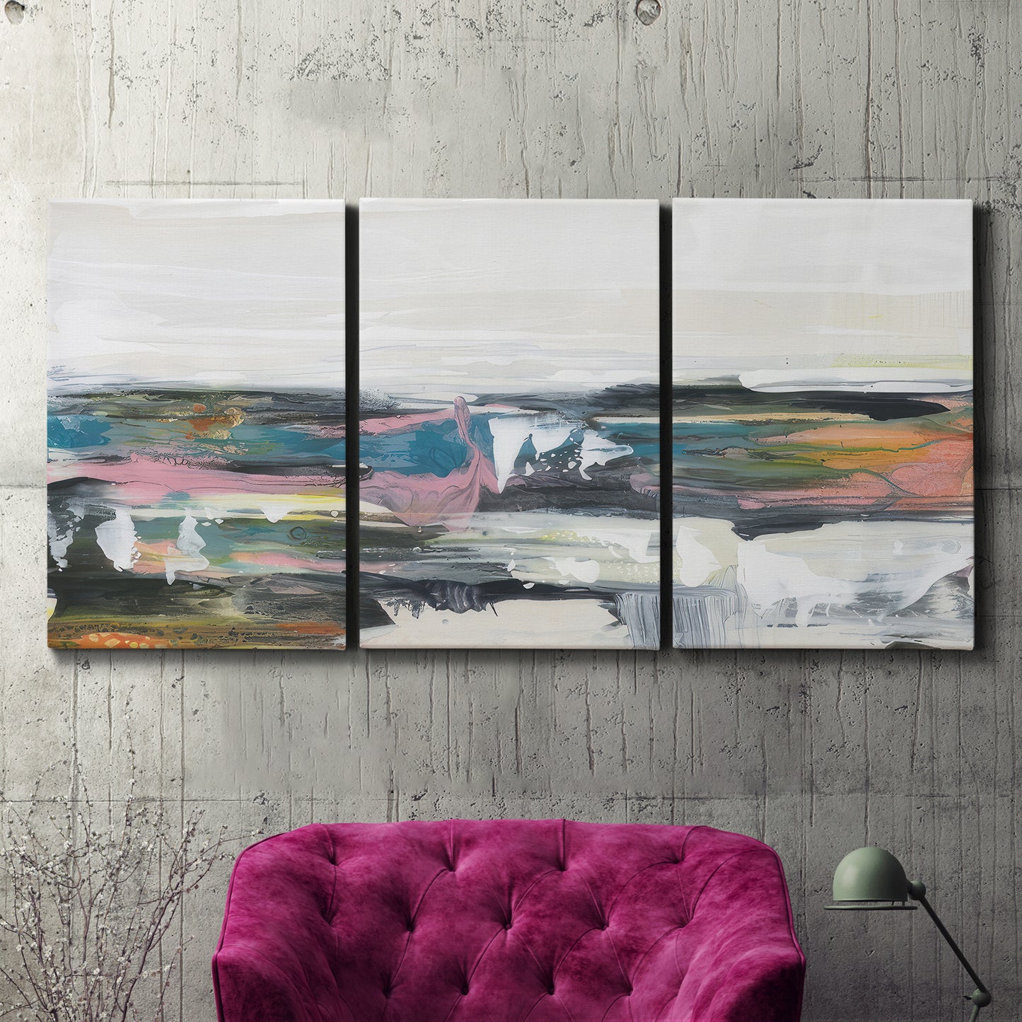Three-panel canvas wall art featuring cheerful abstract coastal seascape, displayed in a living room above a suede accent chair.
