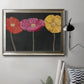 Contemporary poppy flower artwork in an ornate mottled silver frame displayed in a neutral interior setting.