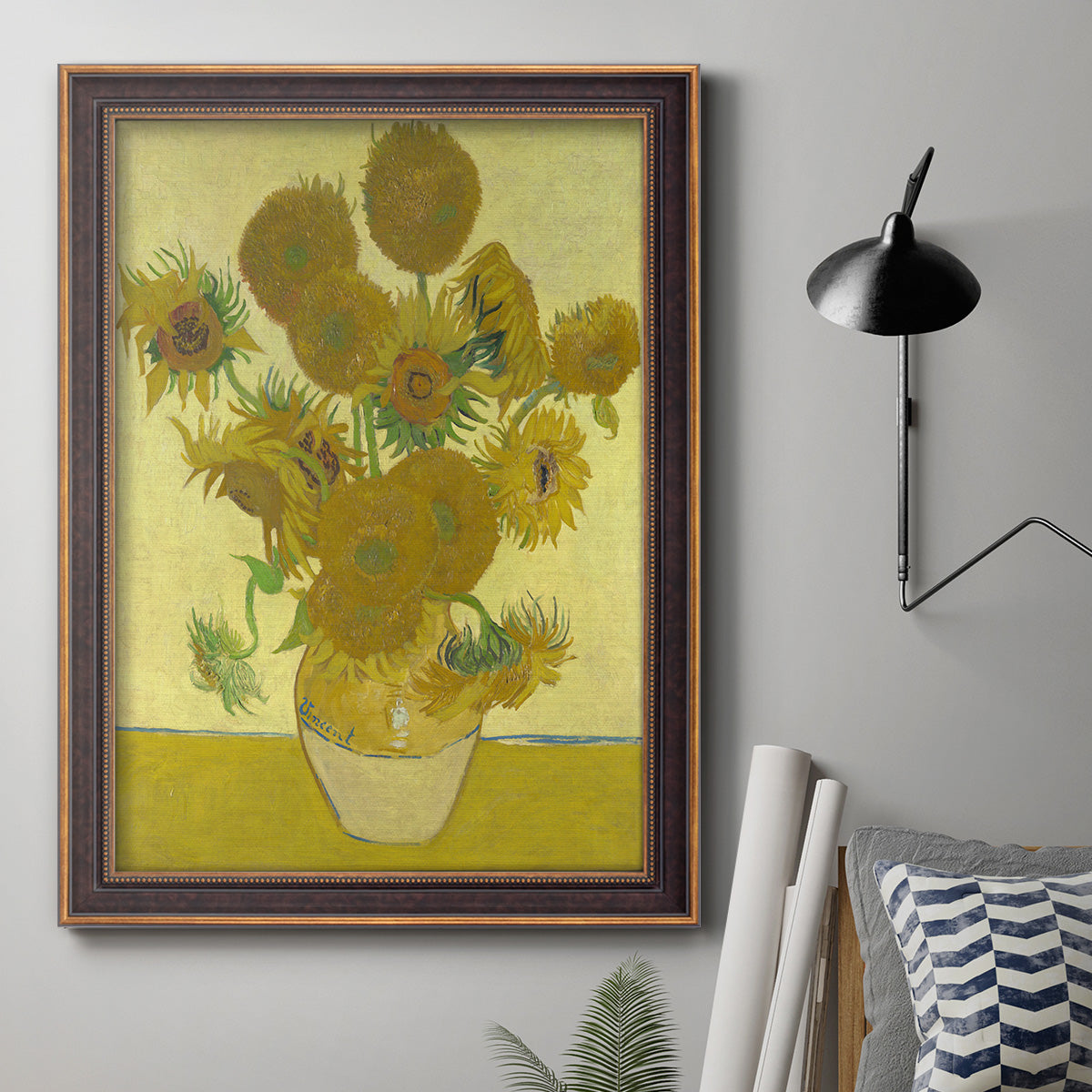 Impressionist sunflower still life painting by Vincent van Gogh in an ornate bronzed mahogany wood frame displayed in a neutral interior setting.