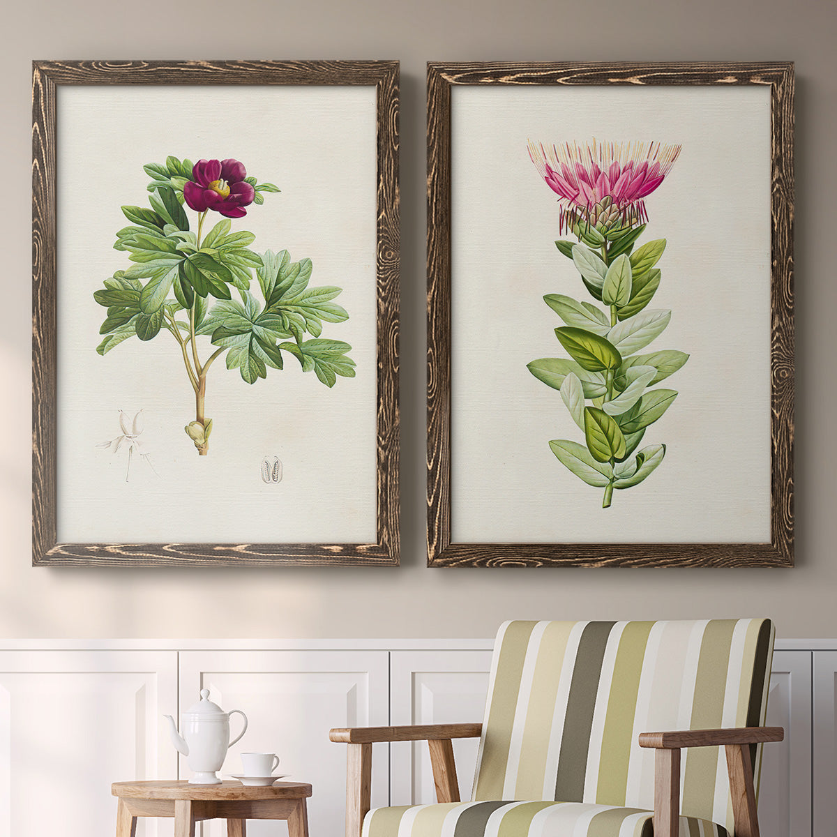 Set of two walnut barnwood framed canvas prints depicting two vintage botanical plate illustrations featuring pink flowering plant specimens above a sideboard in a cozy sitting room.