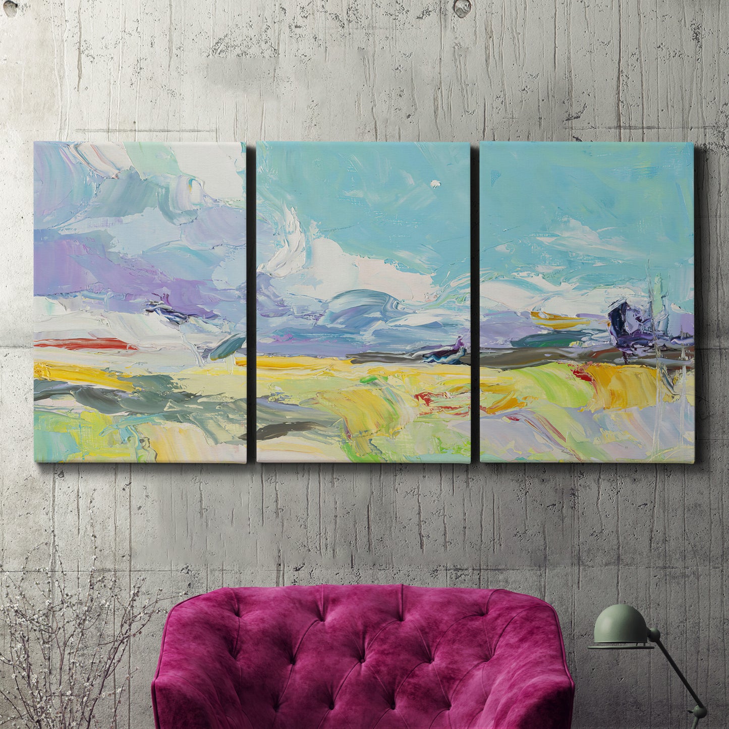 Three-panel canvas wall art featuring open landscape suggesting distant journey, displayed in a living room above a suede accent chair.