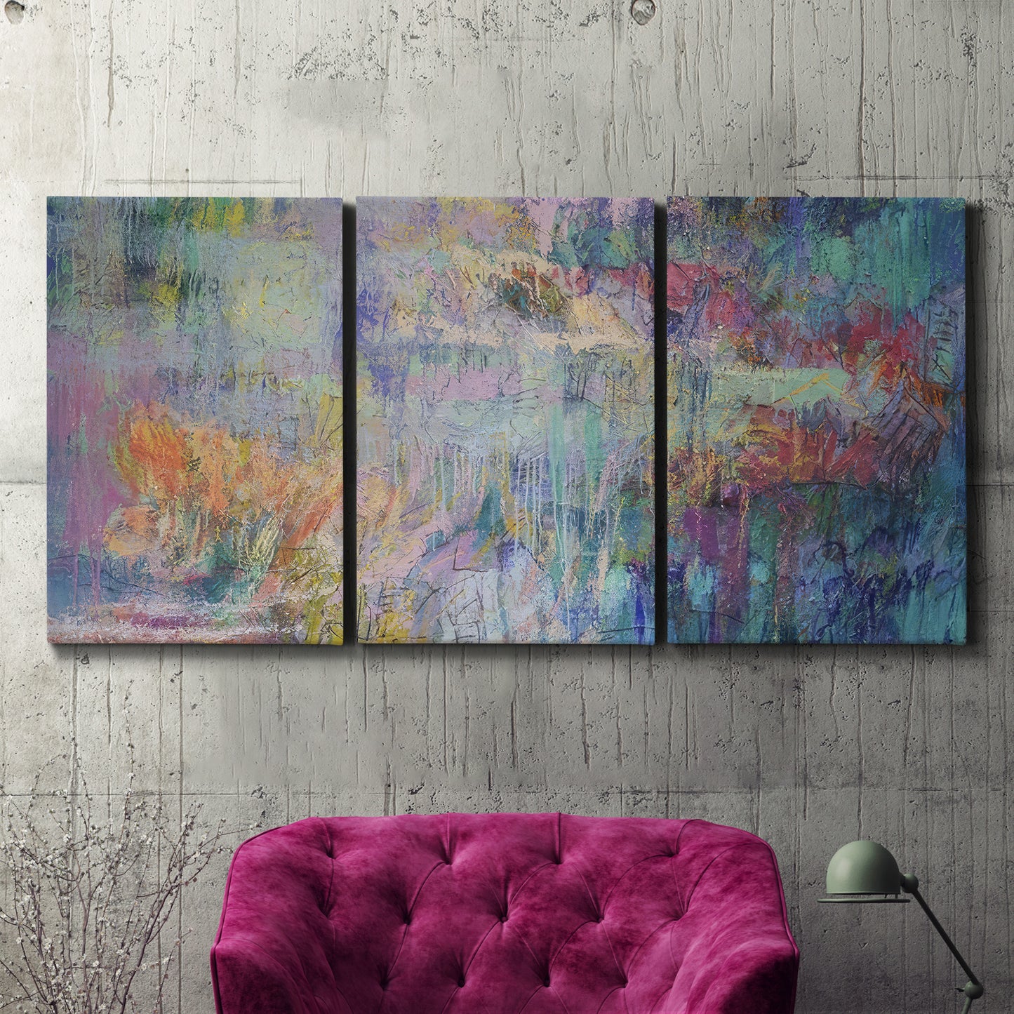 Three-panel canvas wall art featuring abstract evening landscape with depth, displayed in a living room above a suede accent chair.