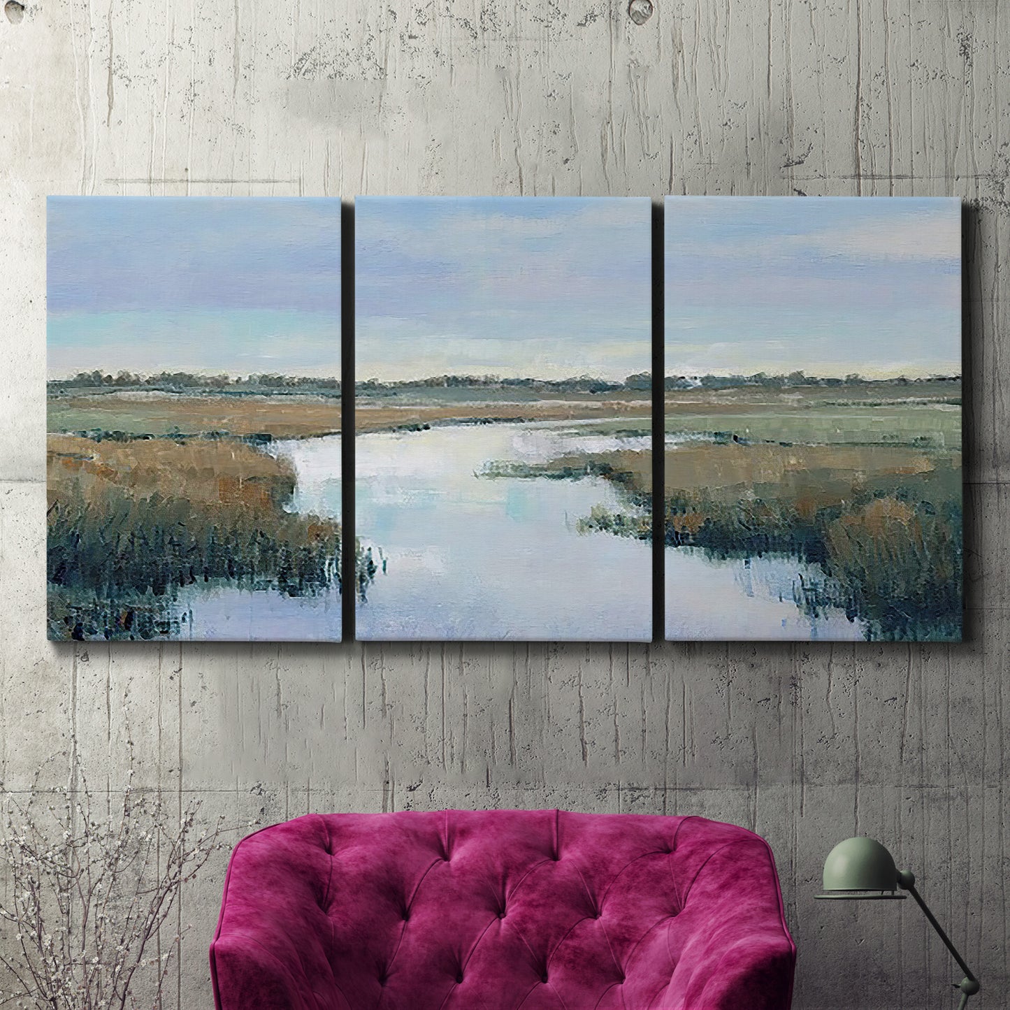 Three-panel canvas wall art featuring coastal plain with layered horizon, displayed in a living room above a suede accent chair.
