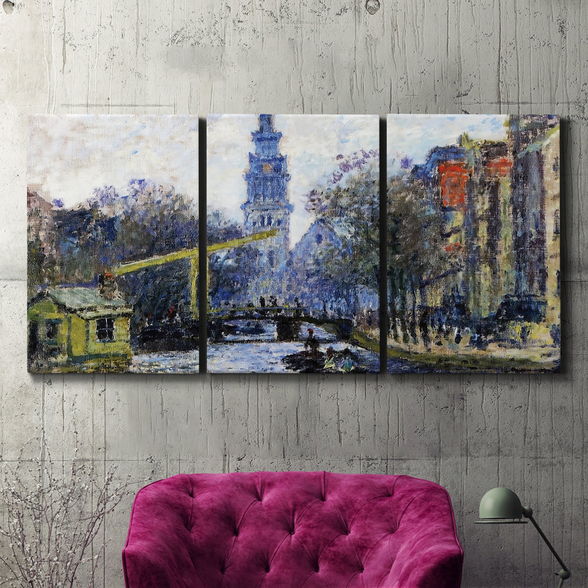 Three-panel canvas wall art featuring historic tower beside canal, displayed in a living room above a suede accent chair.