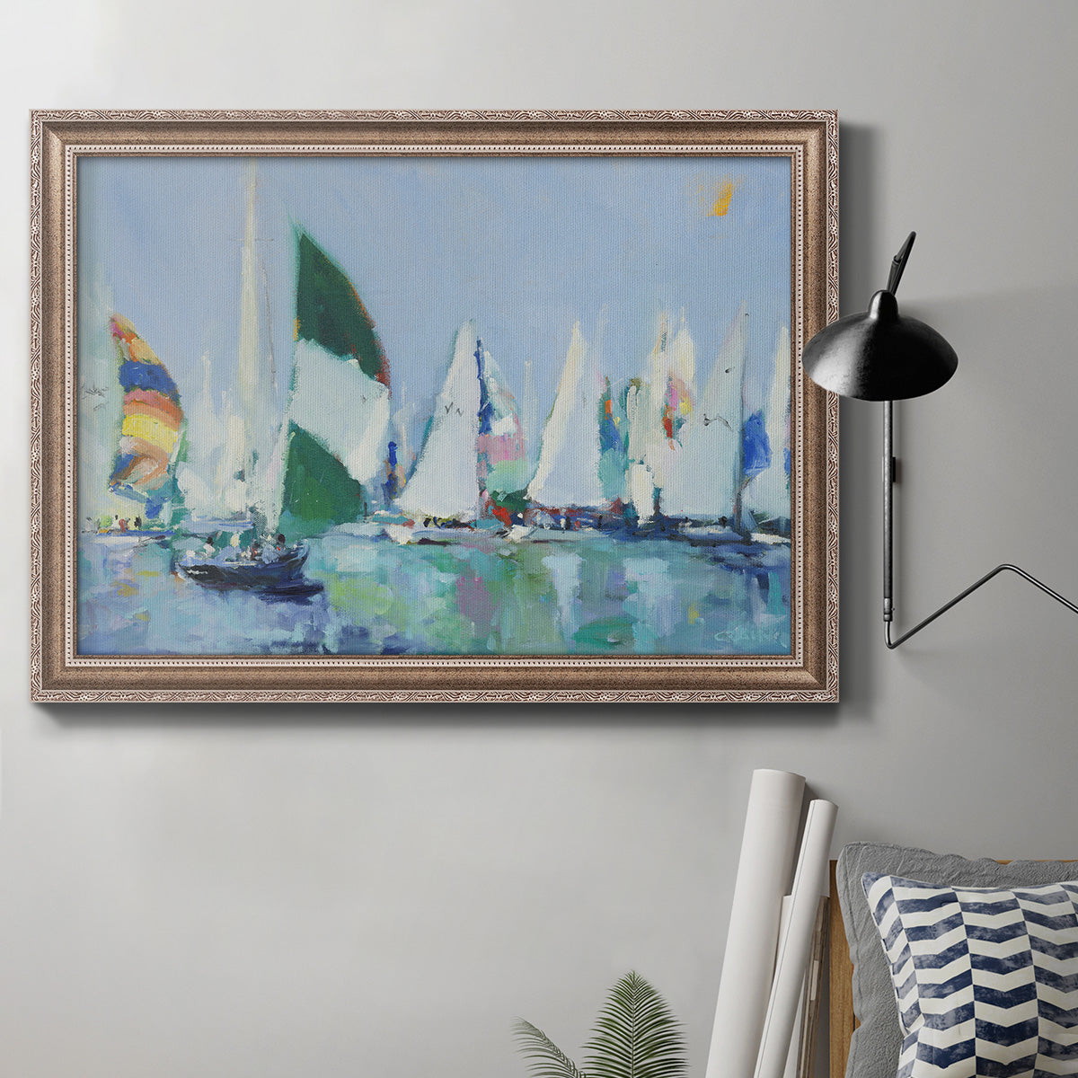 Coastal harbor watercolor painting in an ornate traditional silver frame displayed in a neutral interior setting.