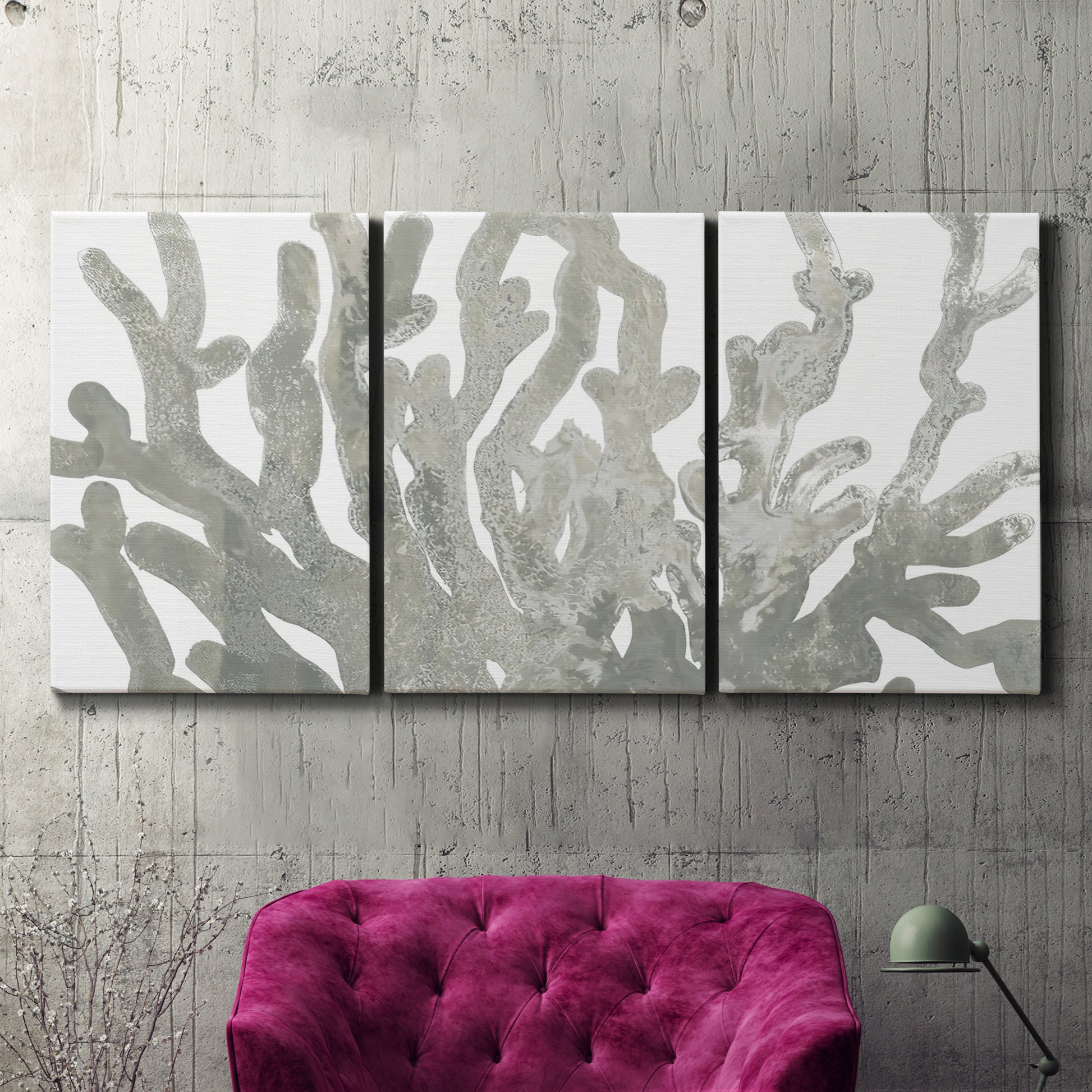 Three-panel canvas wall art featuring monochrome coral texture study, displayed in a living room above a suede accent chair.