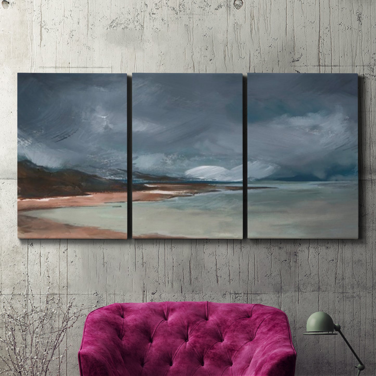 Three-panel canvas wall art featuring stormy sea glass toned coastline, displayed in a living room above a suede accent chair.