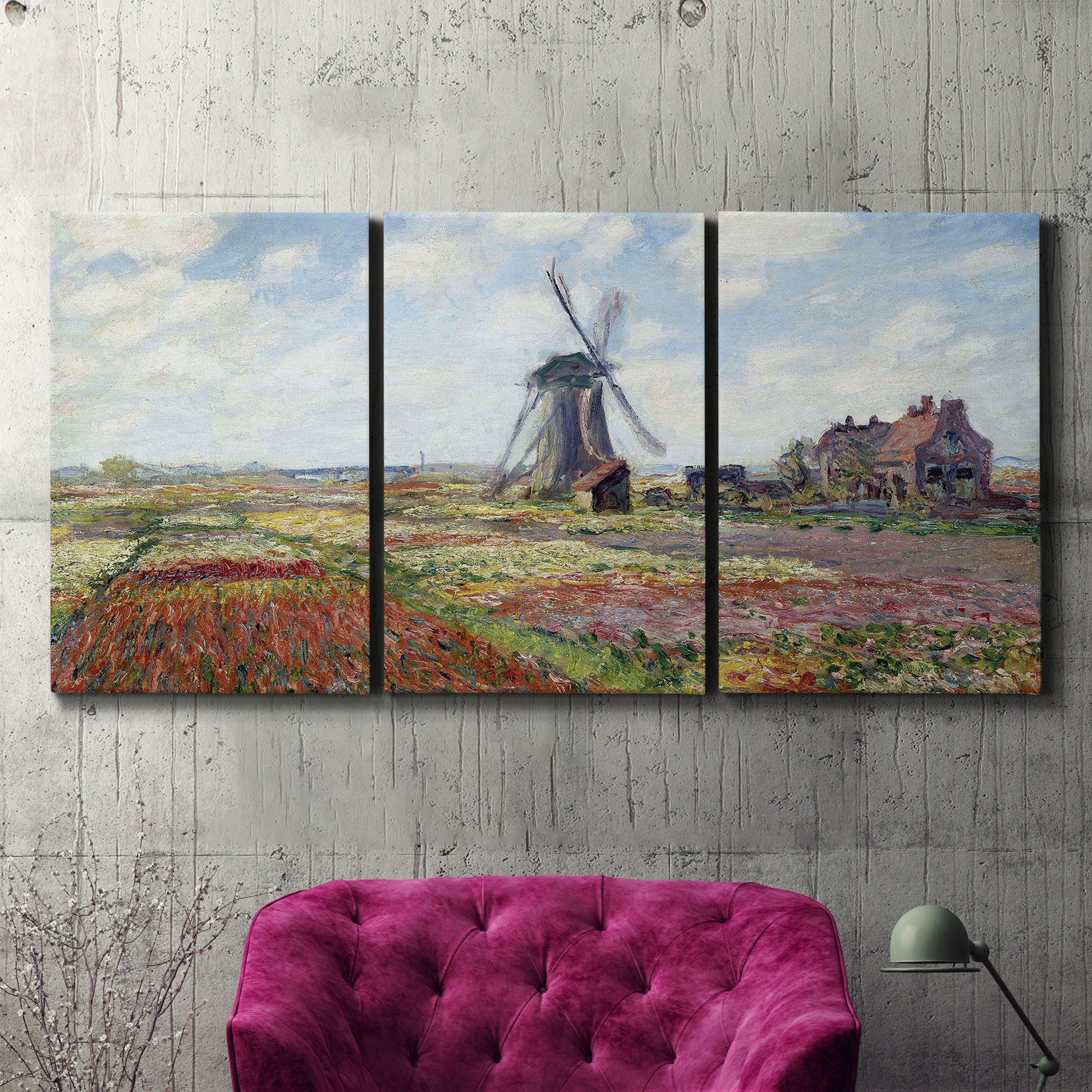 Three-panel canvas wall art featuring tulip fields with windmill, displayed in a living room above a suede accent chair.
