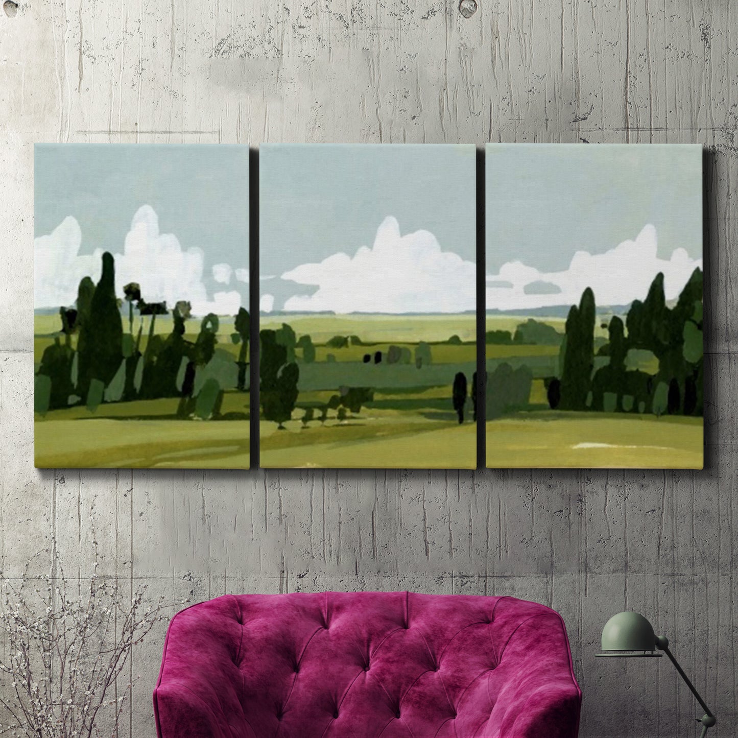 Three-panel canvas wall art featuring lush green summer countryside, displayed in a living room above a suede accent chair.
