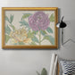 Contemporary peony flower illustration in an ornate antique gold frame displayed in a neutral interior setting.