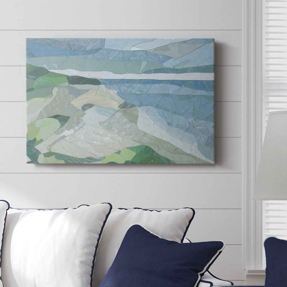 Colorful geometric landscape artwork depicting a coastal view with blue waters and green hills during daytime